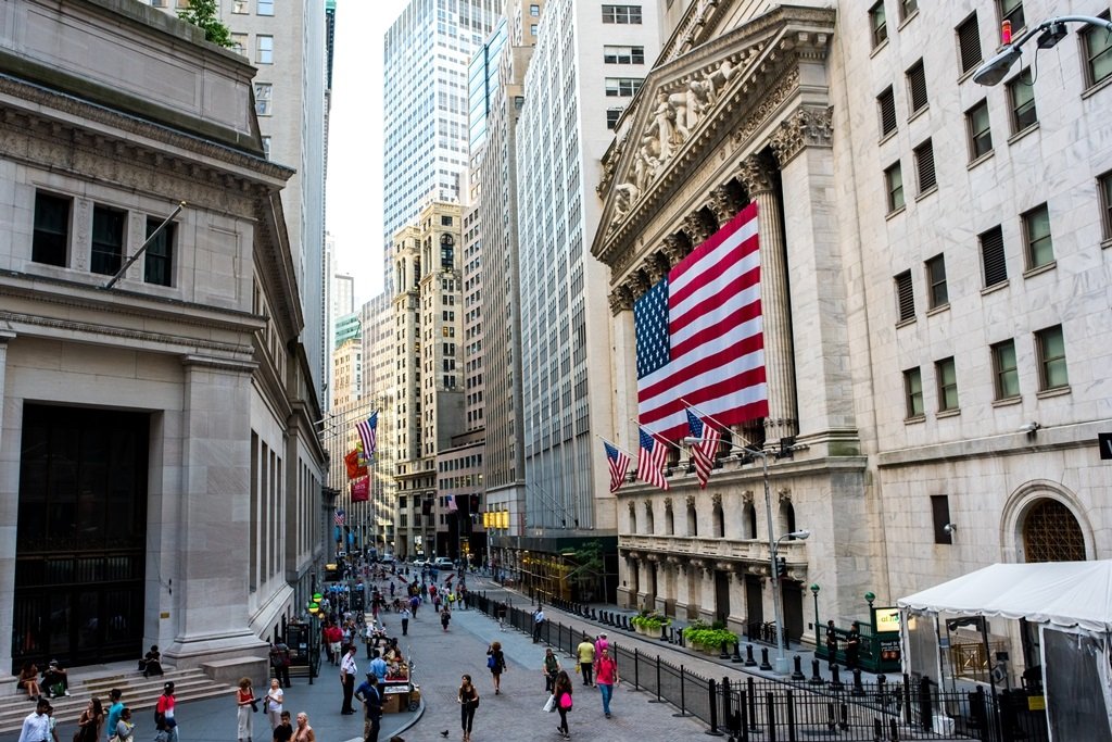 New York, NY: August 27, 2016: Flag draped NYSE on Wall Street. The New York Stock Exchange (NYSE) is the largest stock exchange in the world by market cap.; Shutterstock ID 542390482; Departmental Cost Code : 162800; Project Code: GMKT_SUP_4.9.1E; PO Number: GBLMKT/2015-082